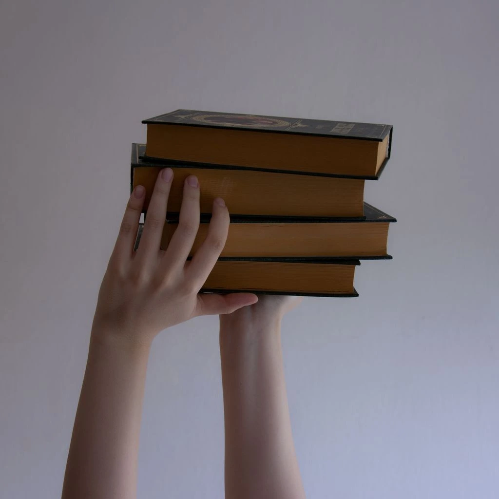 A stack of reader letters and postcards on a wooden desk